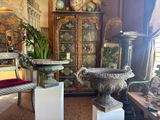 a room with a lot of antiques on display in it