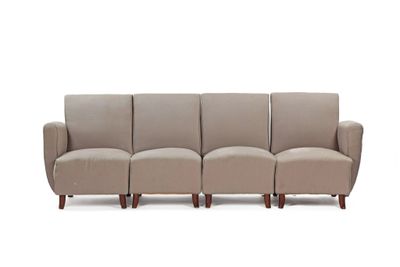 a close up of a couch with four chairs on it