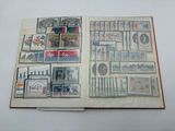 an open book with a lot of stamps on it