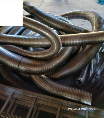 a pile of metal pipes sitting on top of a table