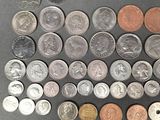 a lot of coins that are on the table