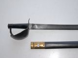 two swords on a white surface one has a gold handle