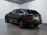 the rear end of a black audi qx parked in a garage