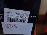 a box with a price tag on it next to a cell phone