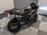 a motorcycle that is sitting on a checkered floor