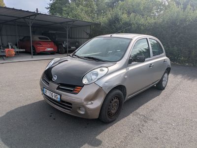 a picture of a small car parked in a parking lot