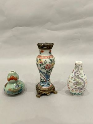three vases sitting next to each other on a table