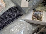 a pile of blankets and blankets that are wrapped in plastic