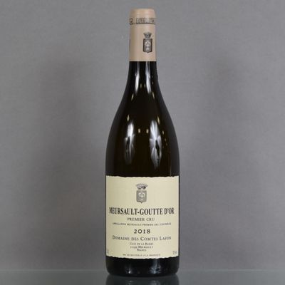 a bottle of wine that is sitting on a table