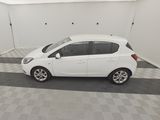 a picture of a small white car in a garage