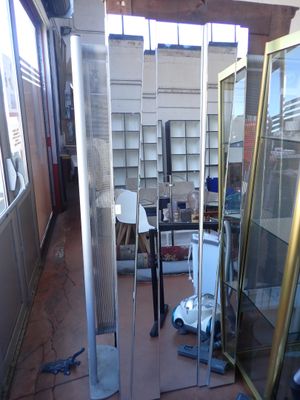 a room with a lot of glass shelves and a vacuum in it