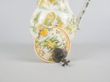 an image of a ceramic pitcher with a bird on it
