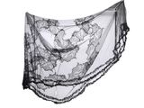 black and white photograph of a woman ' s shawl on a white background
