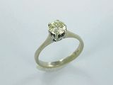 a picture of a diamond ring on a white surface