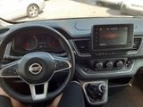 someone is sitting in the driver ' s seat of a car