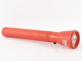 an orange flashlight on a white surface with a white background