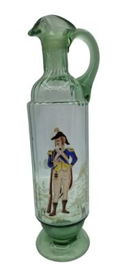 a green glass vase with a picture of a man on it