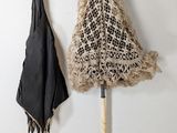 two umbrellas hanging on the wall next to each other