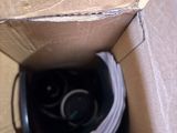a cardboard box with a pair of shoes inside of it