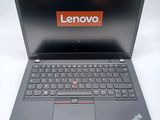 the lenovo laptop is open and ready to be used