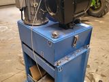 a machine that is sitting on top of a blue box
