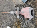 a hammer that is laying on the ground next to a hammer