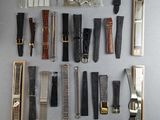 a lot of different types of scissors and combs laid out on a table