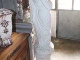 a statue of a woman that is standing in a room