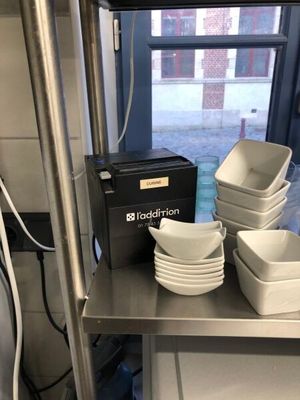 many bowls and plates on the shelf in the kitchen
