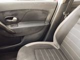 the interior of a car with the door open and the driver ' s seat up