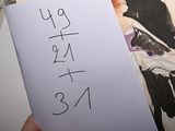 a person holding a piece of paper with a drawing on it