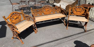 four wooden chairs and a table on the sidewalk