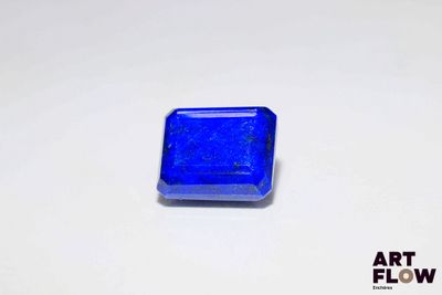 a close up of a blue square shaped object on a white surface