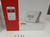 packaging of a white and red box with a clock on top of it