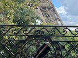 a view of the eiffel tower from a balcony