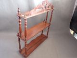 a wooden shelf with a shelf on top of it