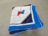 a blue and white scarf with a red bird on it