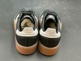a close up of a pair of black and white shoes