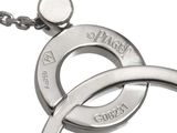 a close up of a necklace with two rings on it