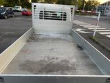 a truck bed with a gate in the back of it