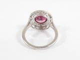 a close up view of a pink tourmaline and diamond ring