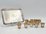 a set of six silverplated cups and a tray with a picture frame