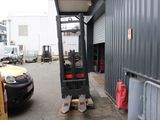 a forklift that is parked in front of a building