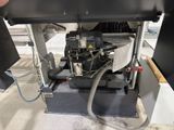 a machine that is working on a piece of machinery