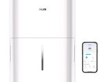 une photo d'un purificateur d'air blanc à côté d'un téléphone portable