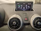 the dashboard of a car with a digital display in the center of it