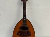 a small guitar that is sitting on a table
