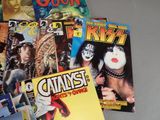 a lot of comic books that are on the table