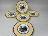 six assiettes jaunes et noires ornées de motifs en noir et blanc