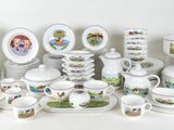 many different types of dishes and cups on the table